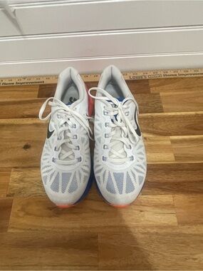 Nike White Running Shoes with Black Swoosh and Blue/Orange Accents